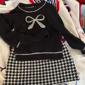 Black and White Sweater with Bow Design